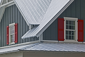 a standing seam metal roof on home with board-and-batten siding