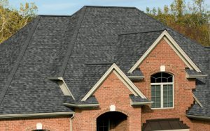 a multi-level asphalt shingle roof on large family home